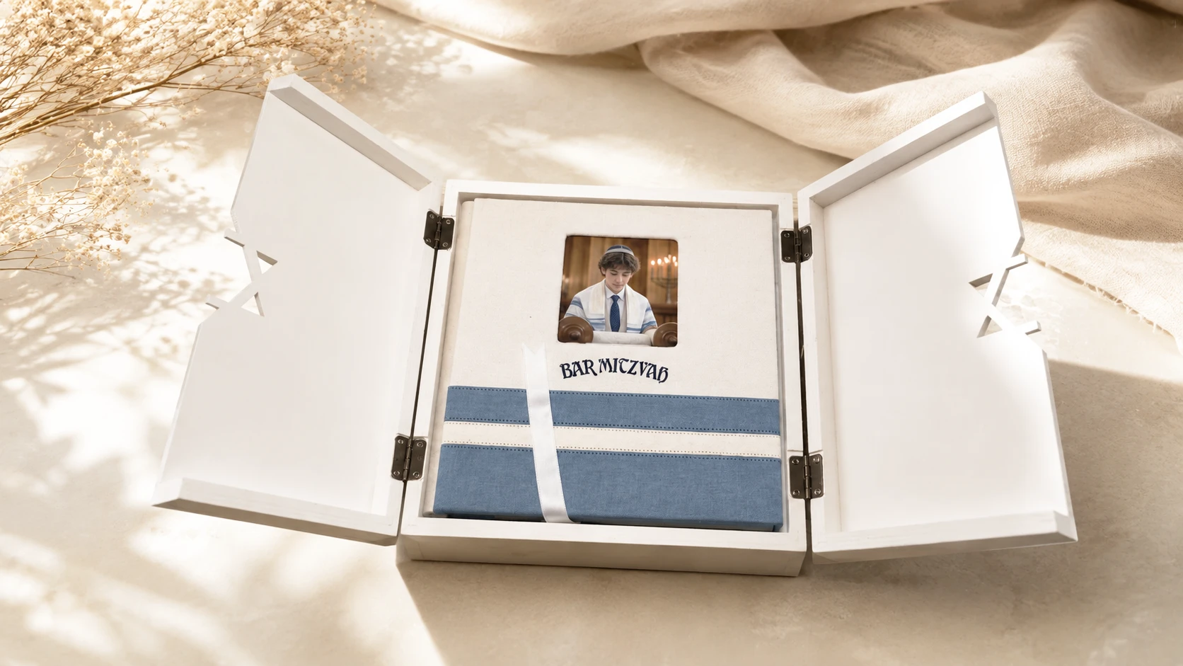 The Simcha Box open, with a linen bar mitzvah album inside the handmade wooden box